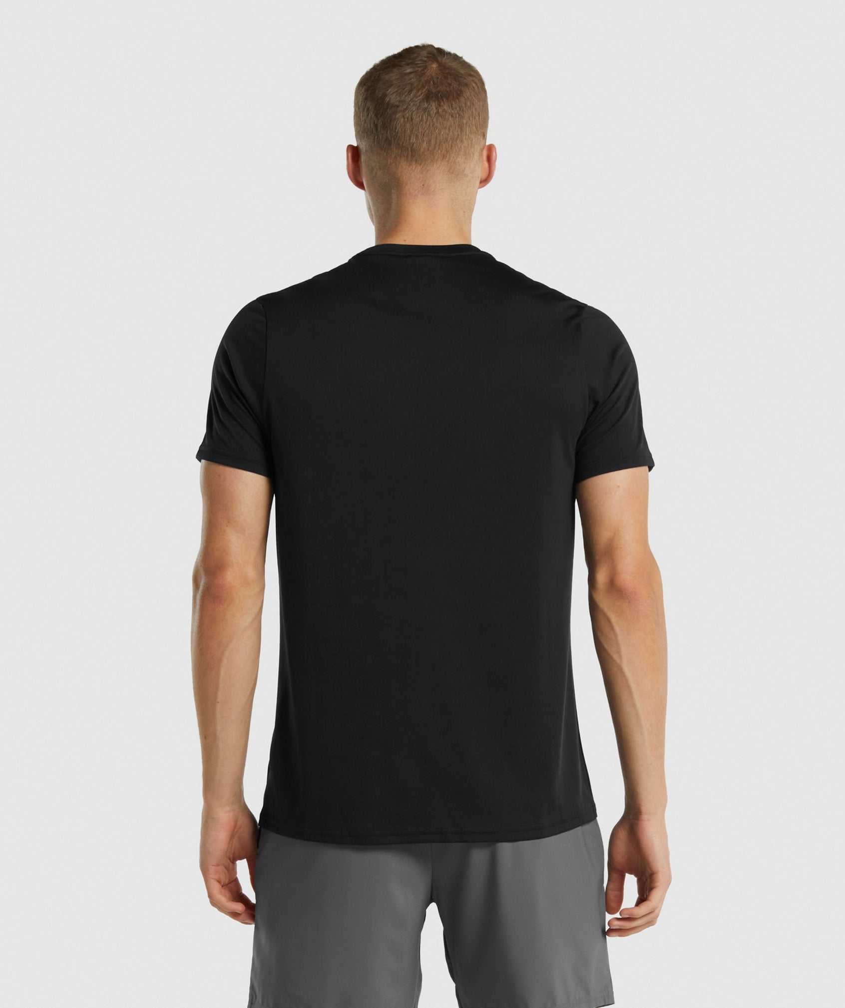 Black Gymshark Arrival Regular Fit Men's T Shirts | XZBLPG086