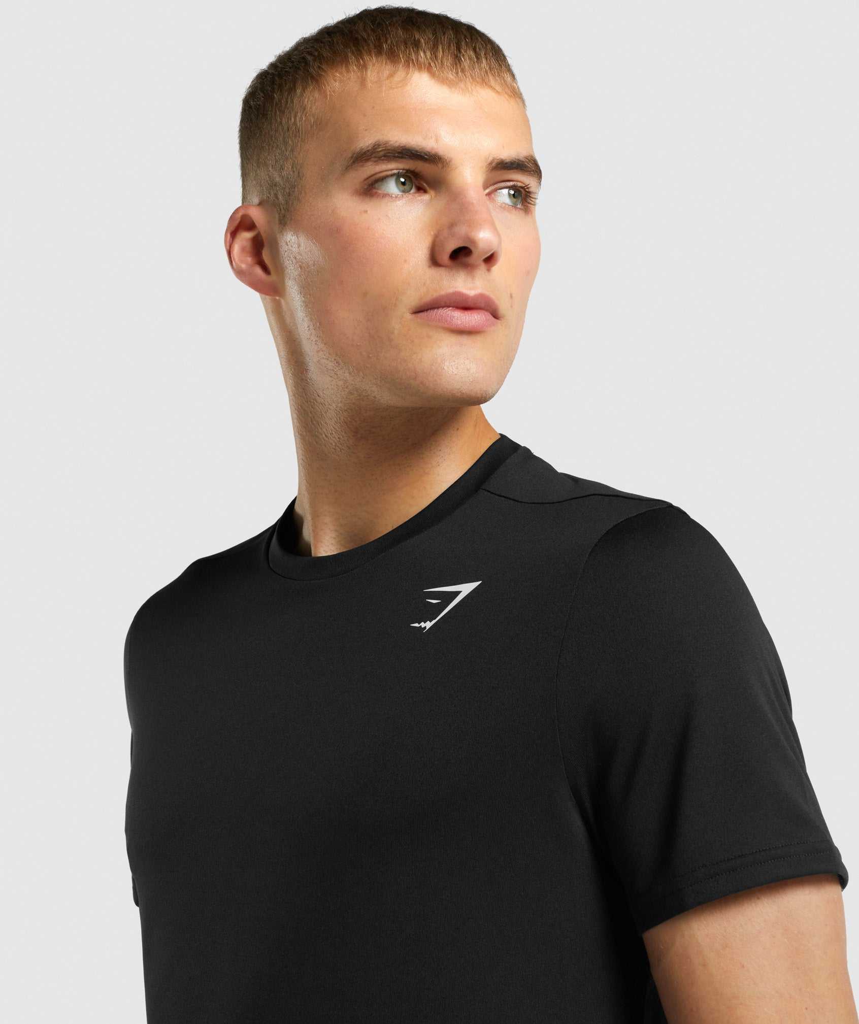 Black Gymshark Arrival Regular Fit Men's T Shirts | XZBLPG086