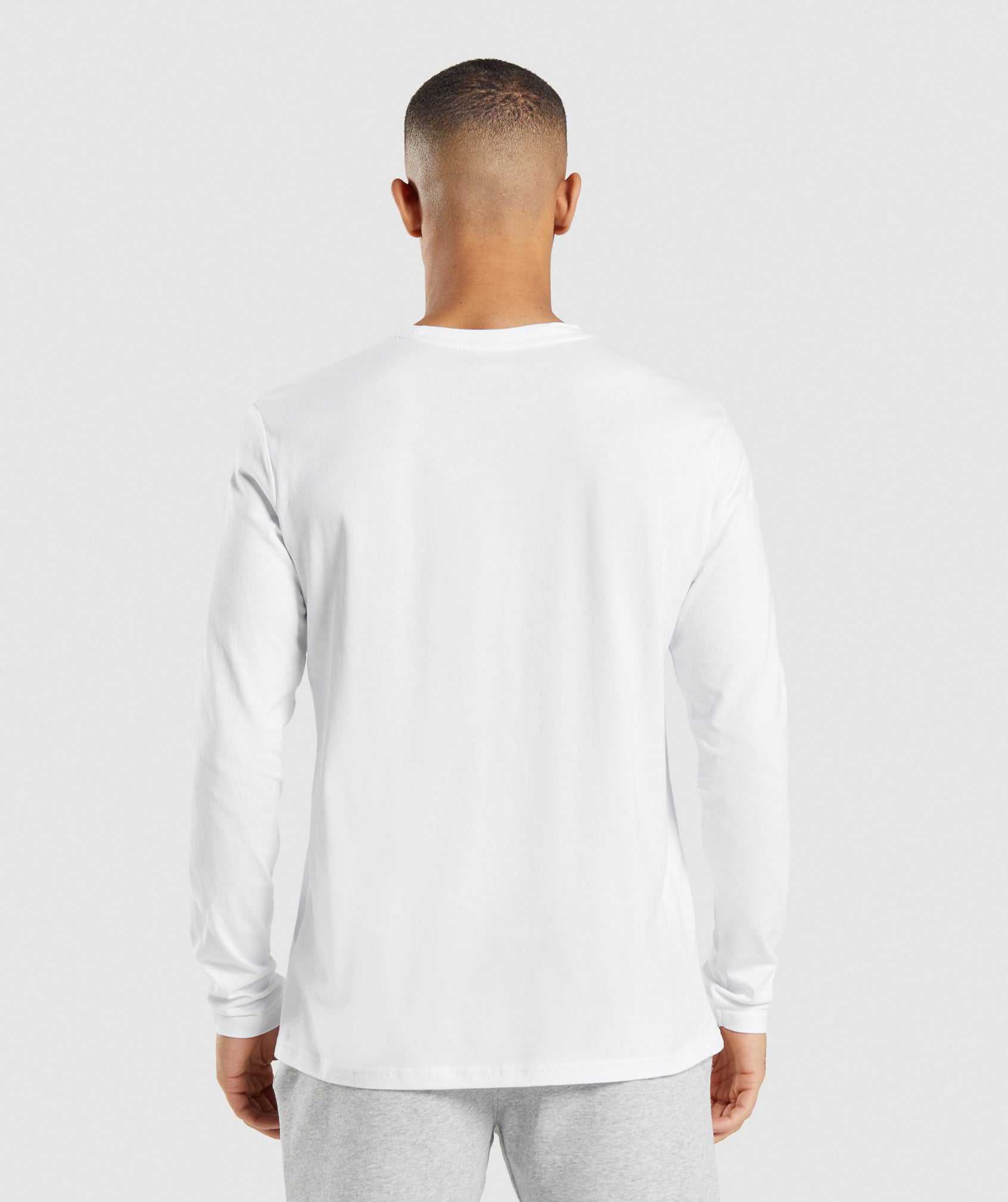 White Gymshark Crest Long Sleeve Men's T Shirts | DRNMOE940